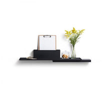 Load image into Gallery viewer, Black Duplex Shelf by Puik against a white background. Decorated with plants and a clipboard.
